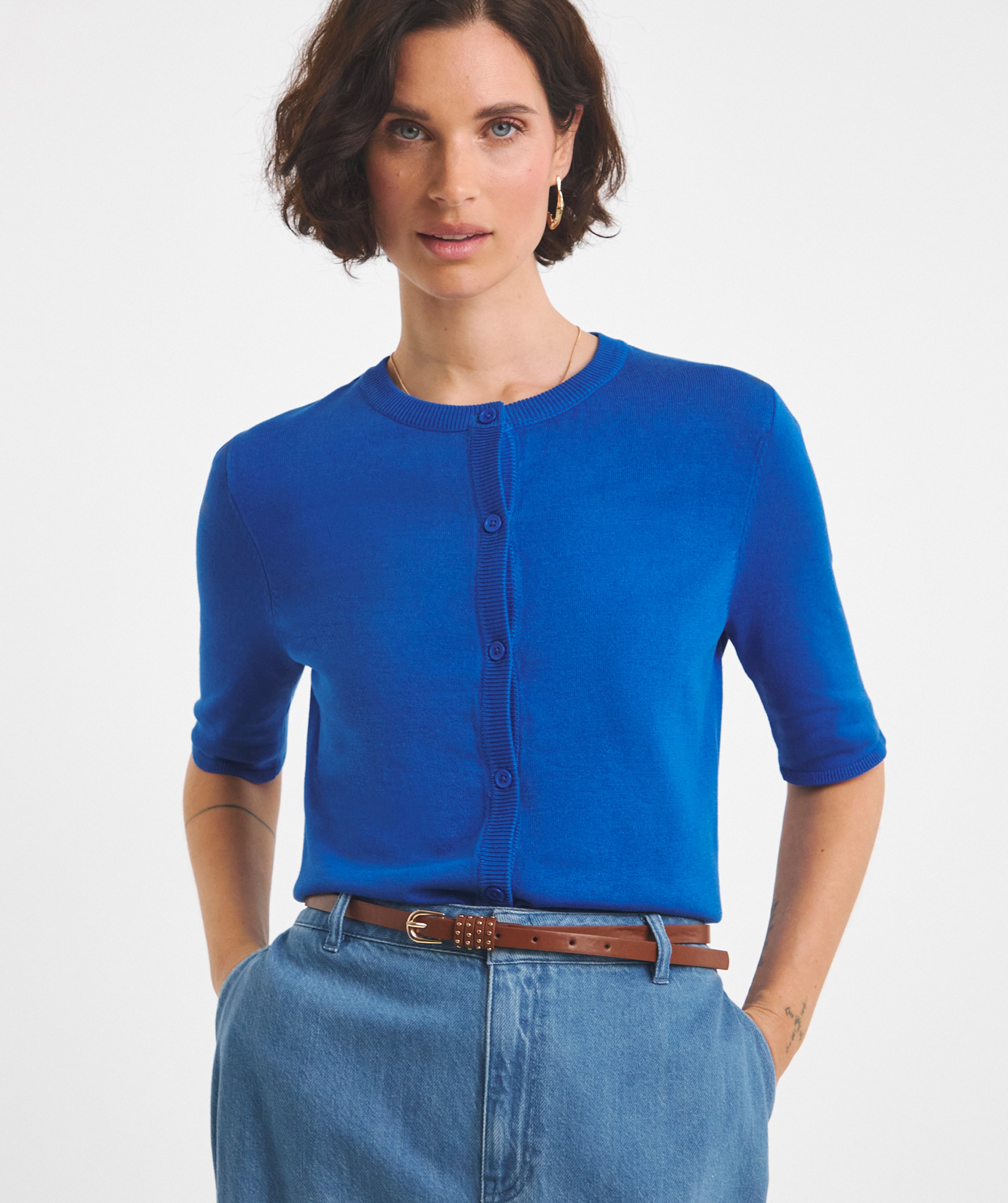 A woman wearing a blue t-shirt and jeans