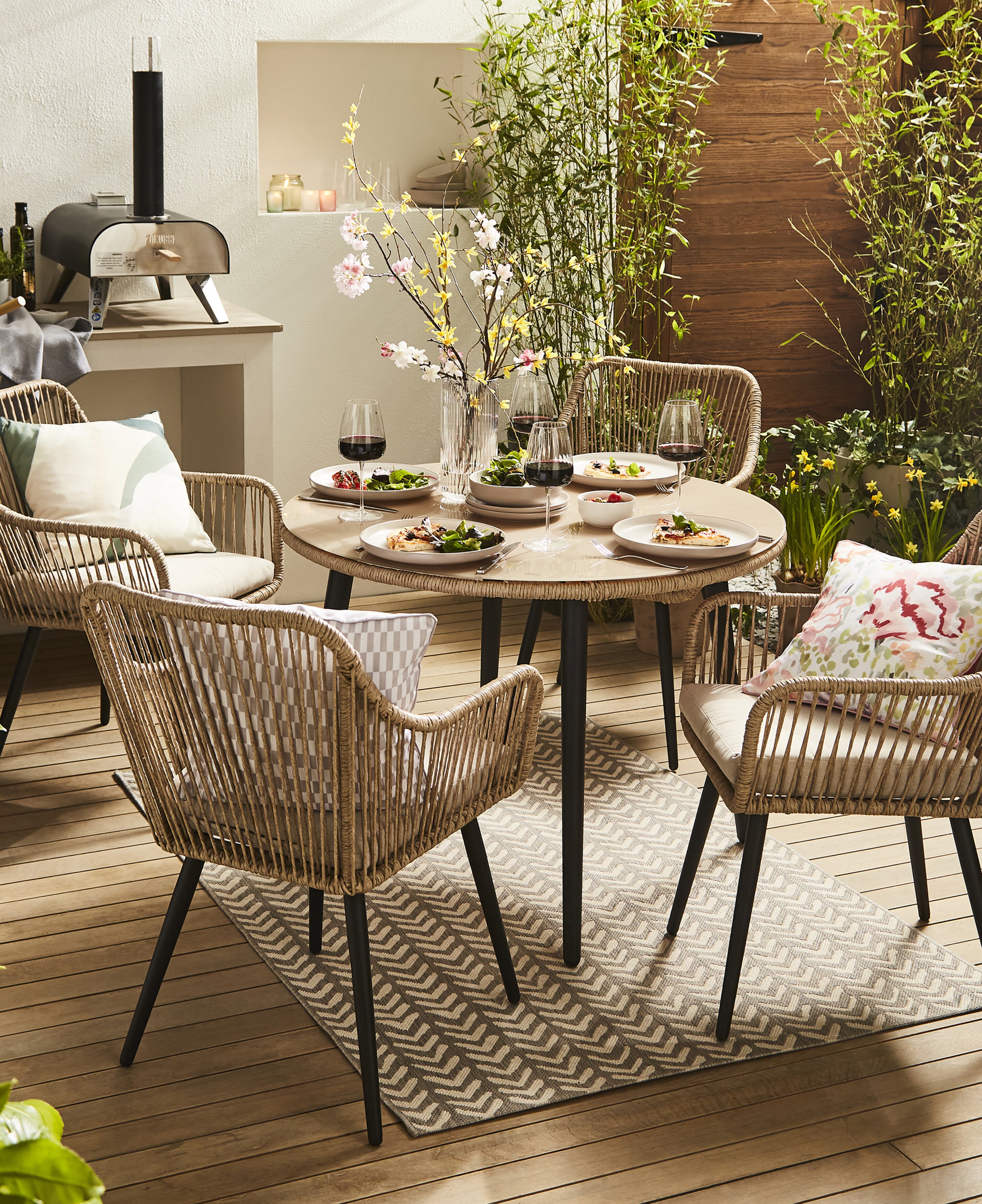 A garden scene with table and chairs