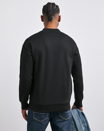 Interlock Relaxed Fit High Neck Sweatshirt- Black