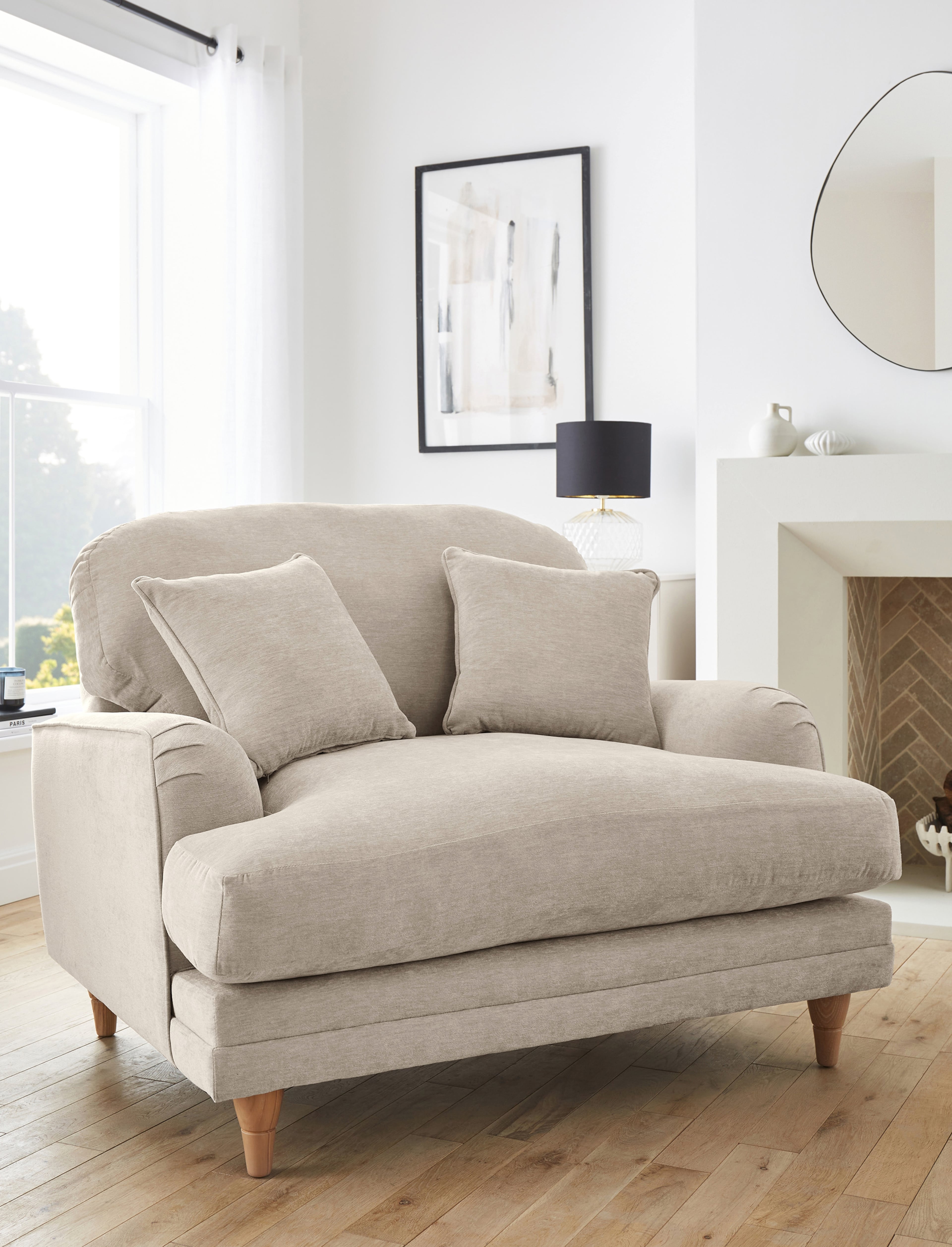 A stone coloured armchair in a lounge